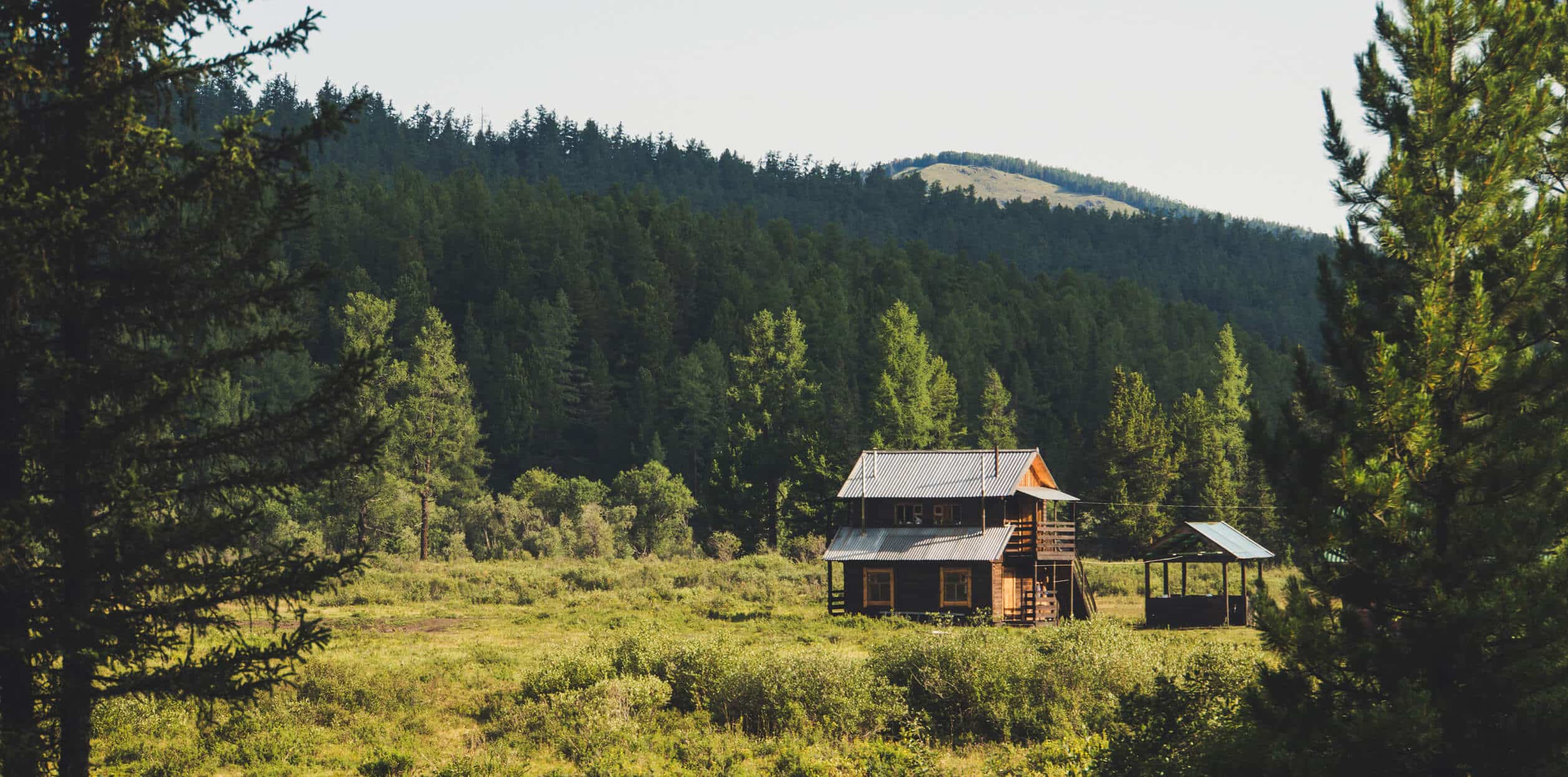 Brown house in middle of field