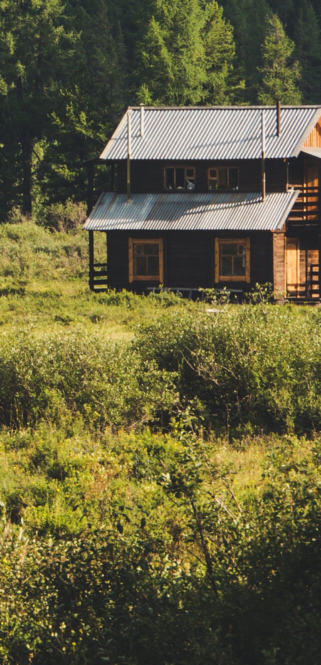 Brown house in the middle of field